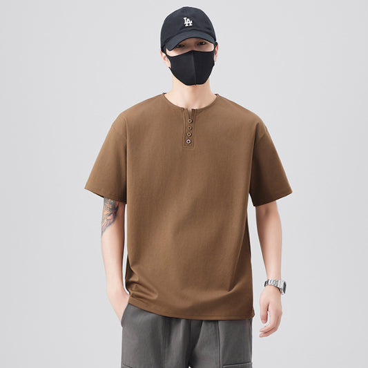 A retro man with a loose Henry collar T-shirt